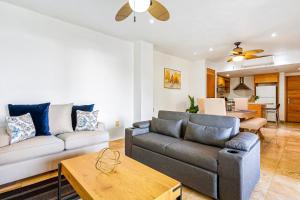 Modern ocean-view stay with pool and rooftop access, large balcony, and AC