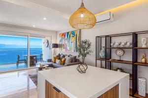 Luxury oceanfront apartment with private balcony, rooftop pool & gym access