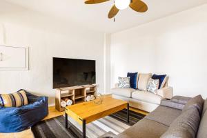Modern ocean-view stay with pool and rooftop access, large balcony, and AC