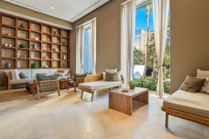 Luxury oceanfront apartment with private balcony, rooftop pool & gym access