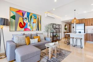 Luxury oceanfront apartment with private balcony, rooftop pool & gym access
