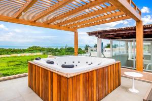Ocean-view getaway with patio, grill, roof deck, & on-site pools