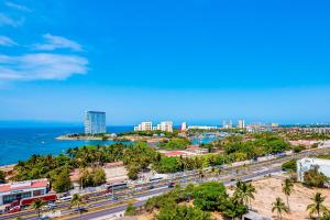 Ocean-view condo in Puerto Vallarta with rooftop pool, fitness room, and balcony