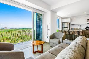 Ocean-view condo in Puerto Vallarta with rooftop pool, fitness room, and balcony