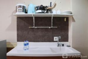 Comfort and Minimalist Studio at Belmont Residence Puri Apartment By Travelio