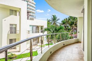 Spacious condo with near the beach with resort-style pool, inviting balcony