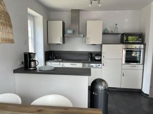 Haus Am Dorfteich B eingefriedet