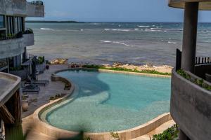 Oceanfront 4BR Duplex in Maiim Tankah with Pool , Spa & Gym