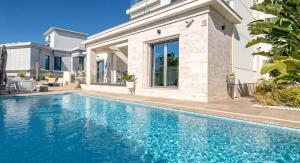 This contemporary beachside villa steps from sea