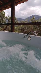 Chalé Aconchego da Lapinha Vista para Montanhas Piscina e Natureza