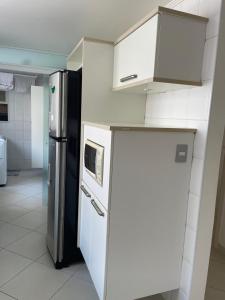 Apartemento 4 suítes e ampla área de lazer em Riviera de São Lourenço