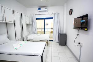 Bin Daher Residential Rooms for Men Guests near DAFZA Metro Station