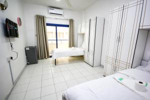 Bin Daher Residential Rooms for Men Guests near DAFZA Metro Station