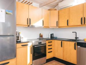 4 person holiday home in Grenaa