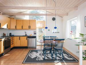 4 person holiday home in Grenaa