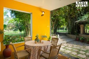 StayVista at The Hideout Farms with Lawn and private Pool