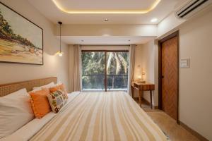 Modern 1BHK in Candolim with Pool & Gym near the Beach by HIREAVILLA