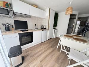 Appt en rez de jardin dans villa parking privé et Patio terrasse