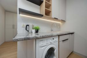 Modern Air-Conditioned Apartment with Balcony by Noclegi Renters