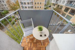 Modern Air-Conditioned Apartment with Balcony by Noclegi Renters