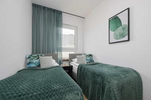 Modern Apartment with Parking & Balcony Suited For Remote Work by Noclegi Renters