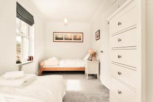 Spacious 3BR Home with Private Garden & Parking