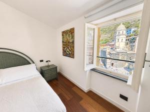 Lassù - Appartamento sulla piazza vista mare