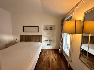 Charming cozy attic loft Top floor apartment with balcony along the Main vibrant walking street Steps from Public gardens Harbour Waterfront Mirabello Port La Spezia city center