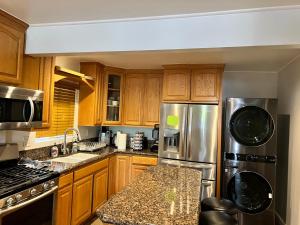 An Amazing comfortable home front middle unit 1q bed and other room with sofa