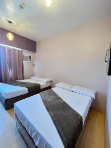 Deluxe Twin Bed at Sunvida Tower across SM CITY
