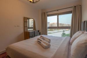 Modern 1BR Retreat in Marassi Prime Location