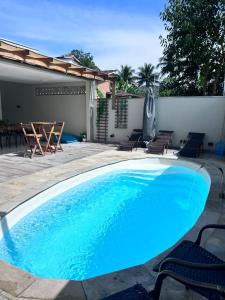 Casa com piscina ,ótima para descanso e lazer
