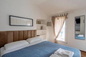 Top floor apartment with balcony along the Main vibrant walking street Steps away from Harbour Waterfront Mirabello Port La Spezia city center Charming cozy attic loft