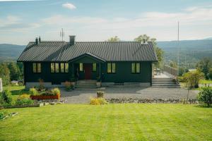 House with fantastic view over both mountain and river