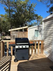 Mobile home avec terrasse salon jardin BBQ