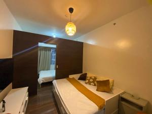 Air Residences Makati 1BR Hall and Balcony