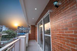 The Brick House! Stylish Furnished 1BHK with Living, Kitchen and Balcony