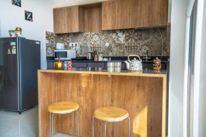 The Brick House! Stylish Furnished 1BHK with Living, Kitchen and Balcony