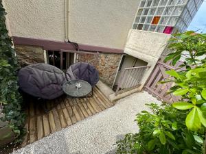 Studio cosy indépendant avec kitchenette et jardinet, proche Paris