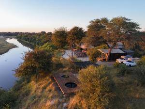 Camp Naledi - Exclusive Safari Tented Lodge with River View I Full Board I Natural Plunge Pools I Free WiFi