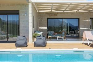Villa Orientem Bis - 2025 Modern Retreat with Infinity Pool & Sunrise Views - by PosarelliVillas