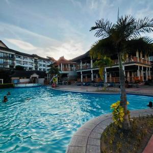 Condo one oasis 2 bedrooms with parking - near SM Ecoland