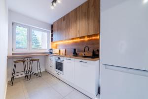 Wola Homely Apartment by BookingHost