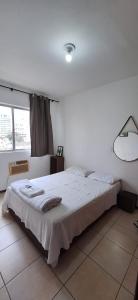 Loft central, cozinha e sala