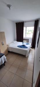 Loft central, cozinha e sala