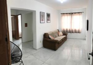 Loft central, cozinha e sala
