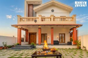 StayVista at Bean and Brick Villa with Bonfire & Garden