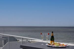 Coastal Comfort with Ocean Views from Shared Rooftop and Separate Pool