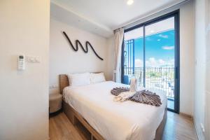 Two-bedroom two-bathroom apartment in Laguna Sky Park featuring golf course views an infinity pool and just 800 meters from the beach Free utilities and internet
