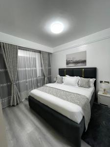 celestial comfort apartments with ample parking space, swimming pool, modern equipped gym, and amazing city views